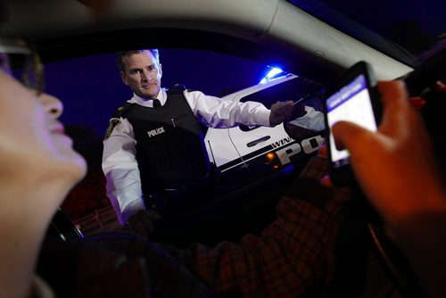 October 7, 2013 - 131007  -  Winnipeg Police Inspector Jim Poole enforces cell phone usage in cars Monday, October 7, 2013. Photo illustration John Woods / Winnipeg Free Press