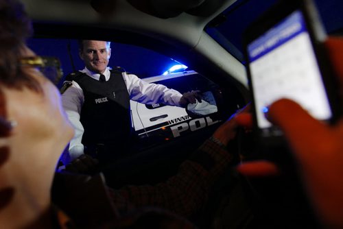 October 7, 2013 - 131007  -  Winnipeg Police Inspector Jim Poole enforces cell phone usage in cars Monday, October 7, 2013. Photo illustration John Woods / Winnipeg Free Press