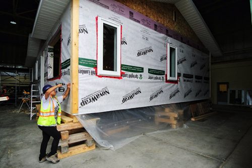 Tesla Cook from Cormorant, MB, works on one of the two homes that are being built by students in the Northern Technical Centre at the Frontier Collegiate Institute in Cranberry Portage, Manitoba. 130917 - September 17, 2013 MIKE DEAL / WINNIPEG FREE PRESS