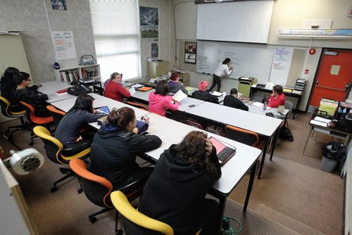 Shari Anderson writes an assignment on the board during her english class at Many Faces Alternative High School in Flin Flon, MB. 130919 - September 19, 2013 MIKE DEAL / WINNIPEG FREE PRESS