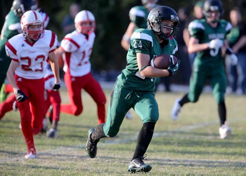 Vincent Massey Trojans' Steinn McIntosh carries the ball against the Kelvin Clippers during their High School Football game at Vincent Massey Collegiate, Wednesday, October 9, 2013. (TREVOR HAGAN/WINNIPEG FREE PRESS)
