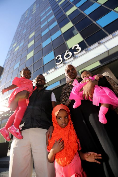 Liiban Shire Ali and Sahra Abdikarim Farah with their children, Bahja Liiban Ali, 1 year, Bushra Ali, 4 years, and Bayaan Liiban Ali, 4mo, outside the courts at 363 Broadway, Wednesday, October 9, 2013. (TREVOR HAGAN/WINNIPEG FREE PRESS) - for carol sanders story