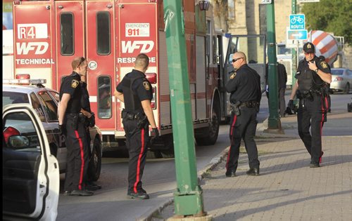 Winnipeg Police and Fire Paramedics in front of the Colony Square on St. Mary Ave. after a stabbing incident Thursday morning.¤¤ Wayne Glowacki/Winnipeg Free Press Oct 10 2013