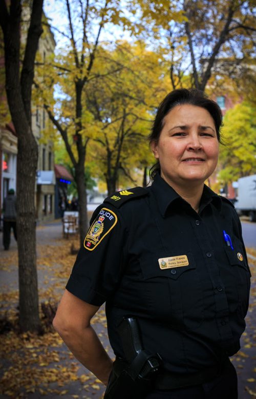One of the first female Winnipeg Police Officers of Aboriginal descent Patrol Sgt. Edith Turner poses in the Exchange District. 131010 - Thursday, October 10, 2013 - (Melissa Tait / Winnipeg Free Press)