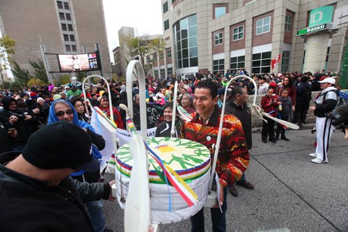 A large group of  drummers and jingle dancers gathered together at the corner of Portage and Main welcoming the UN Special Rapporteur on the Rights of Indigenous Peoples Saturday morning.  Oct   12,, 2013 Ruth Bonneville Winnipeg Free Press