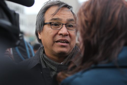 James Anaya, Special Rapporteur on the Rights of Indigenous Peoples, talks with the press on the corner of Portage and Main Saturday during just before a  healing dance that saw hundreds dancers, drummers and supporters  gather together in support of Aboriginal rights. Oct   12,, 2013 Ruth Bonneville Winnipeg Free Press