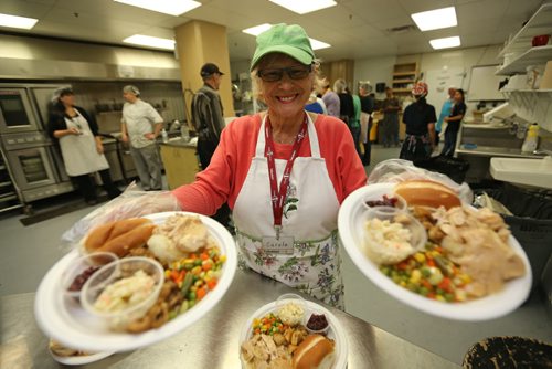 Carole Cockrell helping serve the Thanksgiving meal at Siloam Mission, Monday, October 14, 2013. (TREVOR HAGAN/WINNIPEG FREE PRESS)