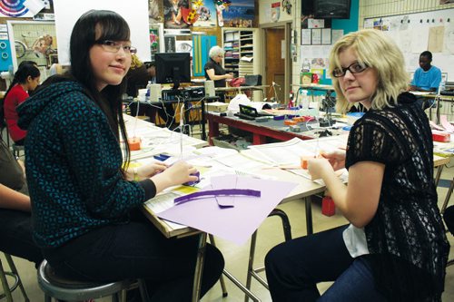 Canstar Community News Oct. 26, 2013 - Kildonan-East Collegiate Grade 10 students Theora Patterson and Tania Wiebe are shown working on sculptures during teacher Angel Audrey's art class. (DAN FALLOON/CANSTAR COMMUNITY NEWS/HERALD)