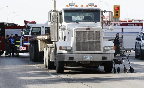 MVC Pedestrian- An elderly man was struck by a semi while crossing the east bound lane Portage Ave at Berry St , eat bound lane is completely closed  and west bound is slow going through the area  KEN GIGLIOTTI / Oct. 16 2013 / WINNIPEG FREE PRESS