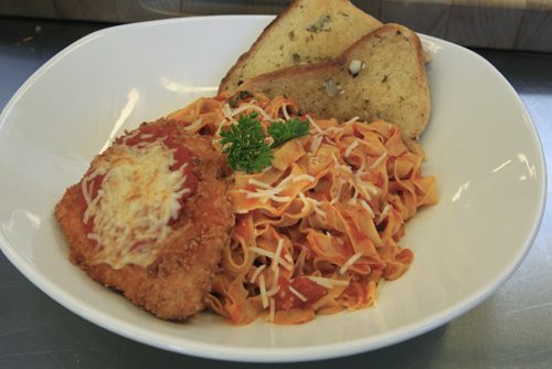49.8 - rrc food column.  Alex Wong's Chicken Parmigiana prepared in the kitchen of the RRC School of Hospitality and Culinary Arts. Keith F. Müller story Wayne Glowacki / Winnipeg Free Press Oct. 16 2013