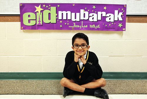 Kaleem Siddiqui, 6, with the banner that he provided for his grade two class at SJR where he also gave a speech for the school about muslim religion. 131016 - October 16, 2013 MIKE DEAL / WINNIPEG FREE PRESS