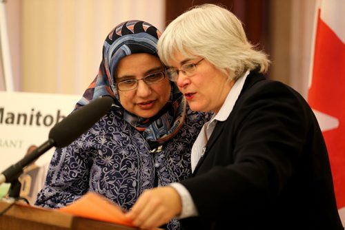 Shahina Siddiqui, Chair, Islamic History Month Canada, and Immigration and Multiculturalism Minister Christine Melnick as she reads a proclamation recognizing October as Islamic History Month, at the Manitoba Legislative Building, October 16, 2013. (TREVOR HAGAN/WINNIPEG FREE PRESS)