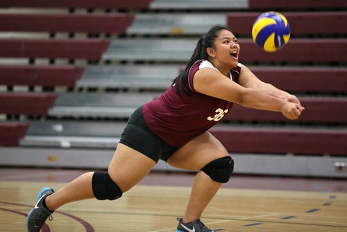 DMCI Maroons'  Abigail Ramos (36) bumps the ball during the first set against the Grant Park Pirates' at Daniel McIntyre during JV Volleyball. The Maroons would win 25-18, 25-17 and 25-27. Thursday, October 17, 2013. (TREVOR HAGAN/WINNIPEG FREE PRESS)