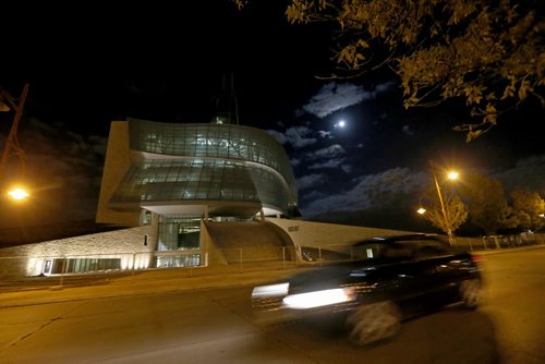 The Canadian Museum for Human Rights, with a nearly full moon, Thursday, October 17, 2013. (TREVOR HAGAN/WINNIPEG FREE PRESS) CMHR