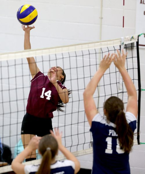 DMCI Maroons' Charisse Ahmad (14), hitting during the teams junior varsity volleyball game at home against the Grant Park Pirates' Thursday, October 17, 2013. (TREVOR HAGAN/WINNIPEG FREE PRESS)