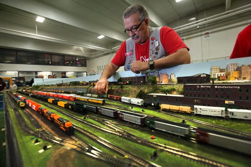 Ray Kindrat one of the original members of Win-N-Trak, series miniature train sets works on their clubs display at the  MB Mega Train Show at Canlan Sports Centre Saturday afternoon.  The show is on Saturday and Sunday till 5pm.   Standup photo  Oct   19,, 2013 Ruth Bonneville Winnipeg Free Press