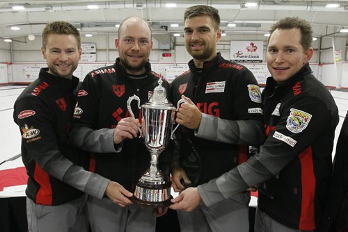 October 21, 2013 - 131021  -  (L to R) Mike McEwen and his team BJ Neufeld, Matt Wozniak and Denni Neufeld were presented with the Dave Elias Memorial Trophy after defeating Glenn Howard in the 2013 Canad Inns Prairie Classic in Portage La Prairie Monday, October 21, 2013. John Woods / Winnipeg Free Press