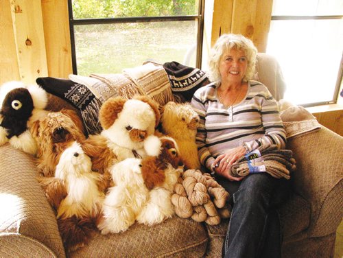 Canstar Community News Oct. 1, 2013 - Penny Gogush displays some of the items made from alpaca fleece and yarn that she sold at farmers markets this summer. (ANDREA GEARY/CANSTAR COMMUNITY NEWS)