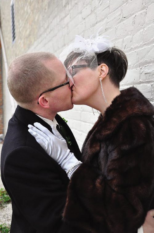 Canstar Community News Oct. 9 -- Susan Bjerring and Nigel Moore incorporated Spence Neighbourhood Association into their wedding day by having their guests donate money to the organization every time they wanted to see the couple kiss. They raised $500. (SUPPLIED PHOTO) METRO