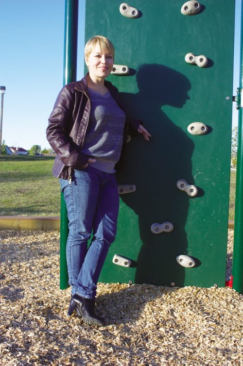 Canstar Community News Oct. 2, 2013 - Eaglemere Residents' Association communications co-ordinator Cindy Lange is shown by the new rock wall in John Coulter Park. (DAN FALLOON/CANSTAR COMMUNITY NEWS/HERALD)