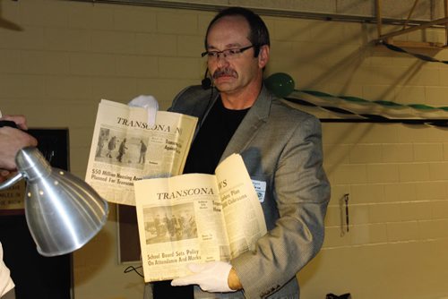 Canstar Community News Murdoch MacKay Collegiate celebrated its 50th anniversay on Saturday with a ceremony that included opening a time capsule that was buried in the school's walls in 1963. Principal Darwin MacFarlane holds up a pair of newspapers found within. (JORDAN THOMPSON)