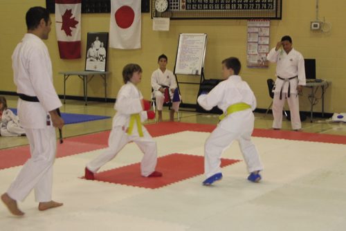 Canstar Community News Oct. 17, 2013 - Winnipeg Open 2013 tournament comissioner Sensei Angelo Mendoza (right) looks on as students of his Bushido-Kai Canada karate school spar. (JARED STORY, CANSTAR COMMUNITY NEWS, THE TIMES)