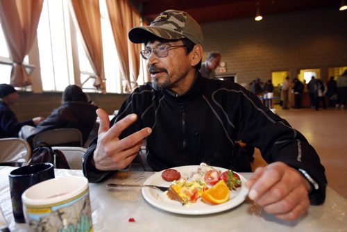 KEN GIGLIOTTI / WINNIPEG FREE PRESS / MAR 31 2010 - 100331 - Sanders,Carol - WORKING POOR -  in pic Arnold Badger  pays for his breakfast - he has a job , and health  issues  and can afford the subsidized food - Subsidized egg breakfast ¾± Agape Table clients are pitching in to pay for egg breakfast ¾± part of a shift from emergency food to sustainable food program where people can order their eggs with a side of dignity ¾± between 9 and 10 am today ¾± Agape Table at Broadway and Colony