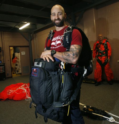 49.8  Training Basket. Master Corporal Jeff Ferguson is a SAR Tech member. He is carrying some of the equip. he has when parachuting on a rescue, a backpack containing a parachute weighing 65lbs. and a medical kit in front weighing 60lbs.   Ashley Prest story   Wayne Glowacki / Winnipeg Free Press Oct. 24 2013