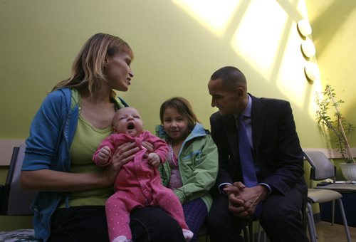 Stephanie Hall with her daughters Ocean, 9 weeks old, and Emily with Kevin Chief, Minister of Children and Youth Opportunities at the Mount Carmel Clinic regarding the Partners in Inner-City Integrated Prenatal Care (PIIPC) program. Carol Sanders story. Wayne Glowacki / Winnipeg Free Press Oct. 25 2013