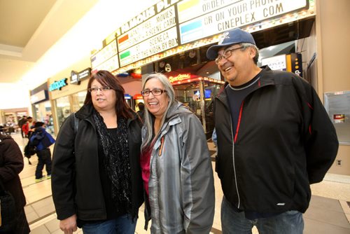 Judith and Douglas Flett, and  their daughter Angela Wood (on far left)  are all smiles after coming out of the special showing of the movie Triumph at Kildonan Park Theatre Saturday morning.  Ruth Bonneville / Winnipeg Free Press