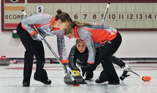 Skip Eve Muirhead (centre) throws a rock during a draw with Team Sweeting in the 2013 Women's Curling Classic at the Fort Rouge Curling Club Sunday morning. 131027 - October 27, 2013 MIKE DEAL / WINNIPEG FREE PRESS