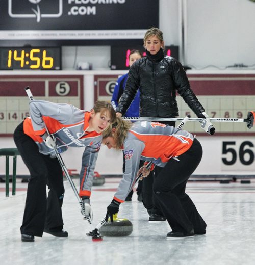 Claire Hamilton (left) looks down the rink after Skip Eve Muirhead threw a rock during a draw with Team Sweeting in the 2013 Women's Curling Classic at the Fort Rouge Curling Club Sunday morning. 131027 - October 27, 2013 MIKE DEAL / WINNIPEG FREE PRESS