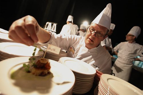 October 25, 2013 - 131025  -    Terry Gereta of Mise, Haute Prairie Cuisine puts the finishing touches to an appetizer dish at Gold Medal Plates at the Convention Centre Friday, October 25, 2013. Gold Medal Plates is an annual competition that celebrates Canadas culinary stars while raising funds for the Canadian Olympic Foundation. Eight of Winnipegs best chefs -- Timothy Palmer (The Velvet Glove), Eric Lee (Pizzeria Gusto), Kelly Cattani  (Elements the Restaurant, by Diversity), Tristan Foucault (Peasant Cookery), Terry Gereta (Mise, Haute Prairie Cuisine), Simon Resch (Terrace in the Park), Michael Schafer (Sydneys at the Forks) and Jason Sopel (Chaise Restaurant & Lounge)-- will be competing John Woods / Winnipeg Free Press