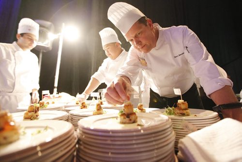 October 25, 2013 - 131025  -    Terry Gereta of Mise, Haute Prairie Cuisine puts the finishing touches to an appetizer dish at Gold Medal Plates at the Convention Centre Friday, October 25, 2013. Gold Medal Plates is an annual competition that celebrates Canadas culinary stars while raising funds for the Canadian Olympic Foundation. Eight of Winnipegs best chefs -- Timothy Palmer (The Velvet Glove), Eric Lee (Pizzeria Gusto), Kelly Cattani (Elements the Restaurant, by Diversity), Tristan Foucault (Peasant Cookery), Terry Gereta (Mise, Haute Prairie Cuisine), Simon Resch (Terrace in the Park), Michael Schafer (Sydneys at the Forks) and Jason Sopel (Chaise Restaurant & Lounge)-- will be competing John Woods / Winnipeg Free Press