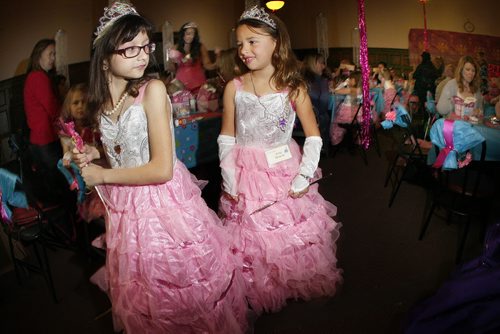 October 27, 2013 - 131027  -   Chloe Poirier (L) shows off her princess dress to her friend Jerzy Minarik at the Princess for a Day festivities at the Canadian Mennonite University Sunday, October 27, 2013. Sixty young girls, some battling life-threatening illnesses, including six from the Childrens Wish Foundation, were crowned Princess for a Day as part of a unique fundraising event for the Childrens Wish Foundation at Canadian Mennonite University Sunday, October 27, 2013. John Woods / Winnipeg Free Press