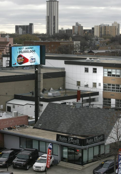 The digital Pattison billboard at 712 Portage Avenue near Gordon Bell High School (at  right). Aldo Santin  story. Wayne Glowacki / Winnipeg Free Press Oct. 28 2013