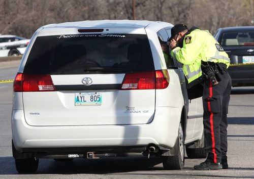 Winnipeg Police Service traffic anaylists investigate a pedestrian mva at Bishop Grandin and St Annes Road that occurred early Tuesday afternoon- Reports from one witness on scene said two youths were hit -See web brief - Oct 29, 2013   (JOE BRYKSA / WINNIPEG FREE PRESS)