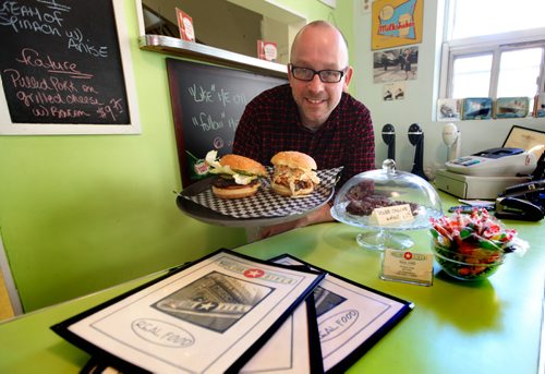 Bruce Smedts - owner/chif at  White Star Diner 58 Albert, with a burger and a pulled pork sandwich.  October 29 2013 Ruth Bonneville / Winnipeg Free Press