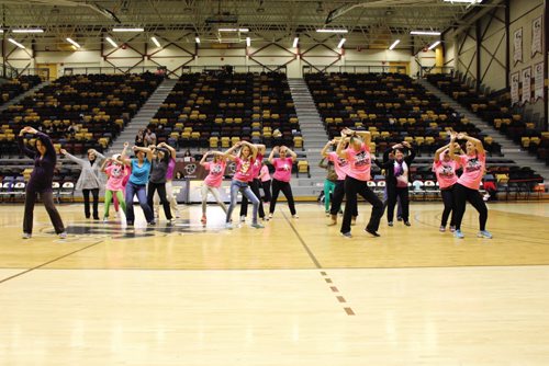 Canstar Community News Flash mob at halftime during a women's basketball game between the University of Manitoba Bisons and the University of Winnipeg Wesmen at the Investors Group Athletic Centre Saturday night.