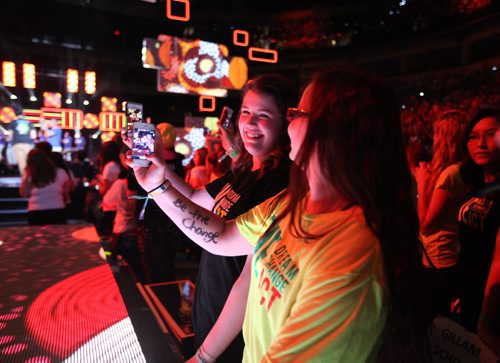 Vanessa Beardy (front with WE Day on arm) and Taylor Allan of Gillam School take part in the events at the front of the stage during the 3rd annual We Day events at MTS Centre Wednesday morning. October 30,  2013 Ruth Bonneville / Winnipeg Free Press