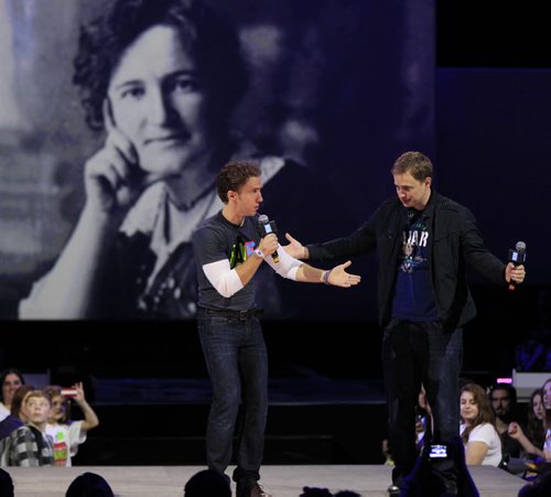Co-founders Craig (left) and Marc Kielburger with a portrait of  Nellie McClung backdrop  at the WE DAY event in the MTS Centre Wednesday.  Wayne Glowacki / Winnipeg Free Press Oct. 30 2013