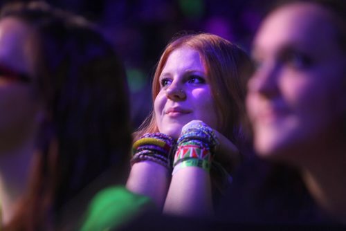 Brooklyn Van Renselaar wears a wrist full of bracelts that she got from her ME to We trip to Kenya with the Potash Corp that she went on with fellow students from Gilam school in northern Manitoba ,listens to the events on stage at the  3rd annual We Day events at MTS Centre Wednesday.   October 30,  2013 Ruth Bonneville / Winnipeg Free Press