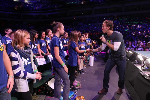 Craig Kielburger, co-founder of Free The Children, shakes the hands of students from H.C. Avery Middle School at the   3rd annual We Day events at MTS Centre Wednesday. October 30,  2013 Ruth Bonneville / Winnipeg Free Press