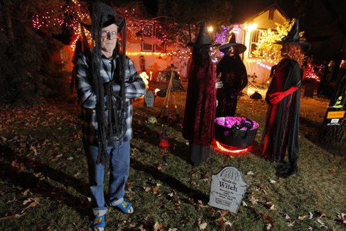 Kingston Row goulster Brian Boes poses in front of his hand made witches that are part of the Halloween extraviganza he and his wife created. They started in 2000 and get over 200 kids come through at Halloween night. BORIS MINKEVICH / WINNIPEG FREE PRESS  October 30, 2013