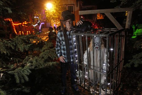 Kingston Row goulster Brian Boes poses in front of his monsters that are part of the Halloween extraviganza he and his wife created. They started in 2000 and get over 200 kids come through at Halloween night. BORIS MINKEVICH / WINNIPEG FREE PRESS  October 30, 2013