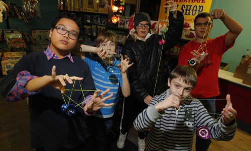 Newbridge Toy Store has started a yo yo night every Wednesday. Kids, teens and any adults interested in learning yo yo tricks are welcome to come down to the store and give 'er a try.  Jean Relleve, Quinn Mudry, Amanda Hebert, Geoffry Wolk, Leon Spivak (front) pose for a group photo. BORIS MINKEVICH / WINNIPEG FREE PRESS  October 30, 2013
