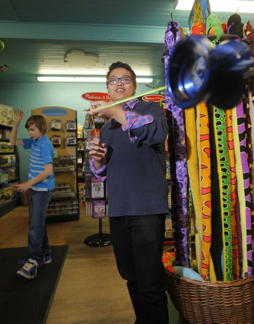Newbridge Toy Store has started a yo yo night every Wednesday. Kids, teens and any adults interested in learning yo yo tricks are welcome to come down to the store and give 'er a try. In photo Jean Relleve does some tricks. BORIS MINKEVICH / WINNIPEG FREE PRESS  October 30, 2013
