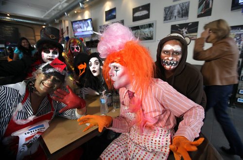 United Way employees from the community investment department  ham it up for the camera as they wait for their  lunch at the Free Press News Cafe while wearing  Halloween costumes with a circus theme Thursday over the lunch hour.   The front person is dressed as a cotton candy clown. Standup photo October 31,,  2013 Ruth Bonneville / Winnipeg Free Press