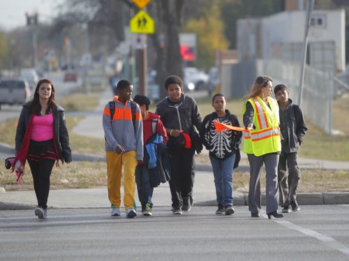 Louis Riel School Division has school patrols on the corner of St. Anne's and Bishop Grandin Blvd. There was an accident that injured two 11 year olds. The school principal and teacher of nearby Victor H.L. Wyatt school do the patroling. BORIS MINKEVICH / WINNIPEG FREE PRESS  October 31, 2013