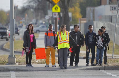 Louis Riel School Division has school patrols on the corner of St. Anne's and Bishop Grandin Blvd. There was an accident that injured two 11 year olds. The school principal and teacher of nearby Victor H.L. Wyatt school do the patroling. BORIS MINKEVICH / WINNIPEG FREE PRESS  October 31, 2013